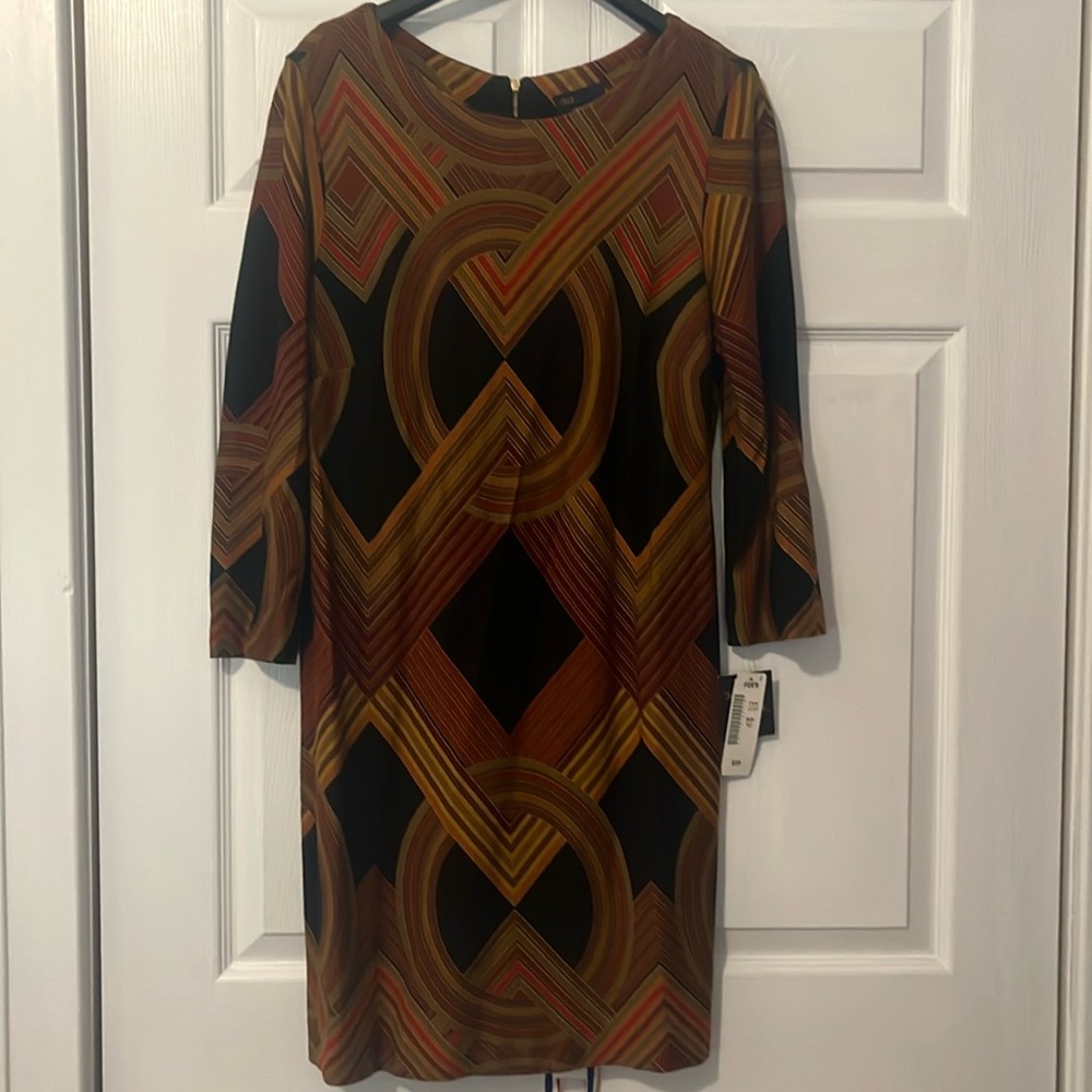 Vibrant three-quarter sleeve dress in cotton material. Made in Malaysia.